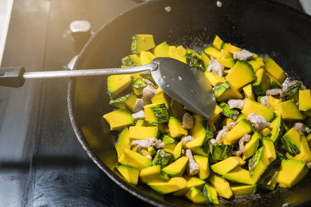 Stir and fry the pork In a frying pan is done in the kitchen. In order to cook Stir Fried pumpkin with pork.Which contains ingredients such as vegetables and meat. Food of Thailand people like to eatの写真素材