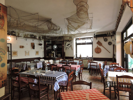 Interior of a traditional Italian restaurant on the shore of Lago di Garda, in Malcesine, Italy, on July 19, 2015.の写真素材