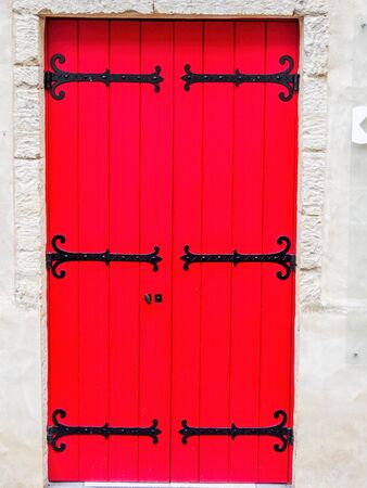 red door with white wallの写真素材