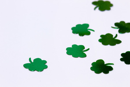 Green Shamrocks and four leaf clovers on a White Backgroundの写真素材