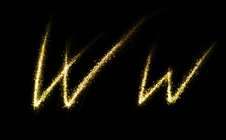 W letter of gold glittering stars dust flourish tail. Glittering font conceptの写真素材