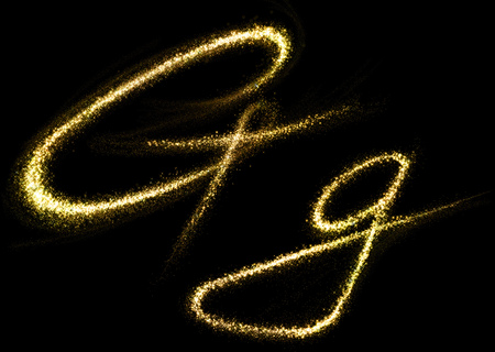 G letter of gold glittering stars dust flourish tail. Glittering font conceptの写真素材