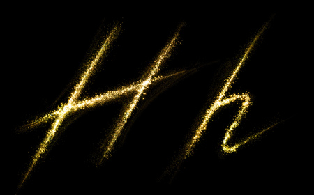 H letter of gold glittering stars dust flourish tail. Glittering font conceptの写真素材