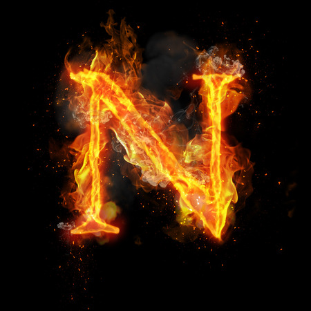 Fire letter N of burning flame. Flaming burn font or bonfire alphabet text with sizzling smoke and fiery or blazing shining heat effect. Incandescent hot red fire glow on black backgroundの写真素材