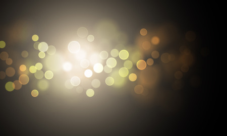 Gold light sparkles and blur or defocused golden glitter on sparkling vector black background. Golden glowing texture with premium luxury shimmering bokeh effectのイラスト素材
