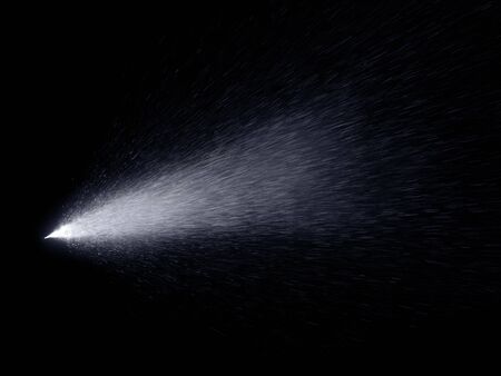 Water mist spray with drops in motion isolated on black background. Abstract cosmetic aerosol spraying illustration.の写真素材
