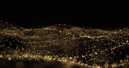 Golden glitter, light particles wave, golden sparks glow and light wave with bokeh shimmer on black backgroundの写真素材
