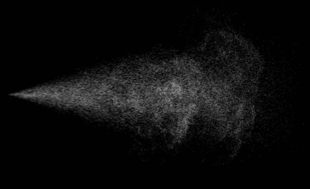 Spraying mist effect of air gun sprayer droplets jet isolated on blackの写真素材