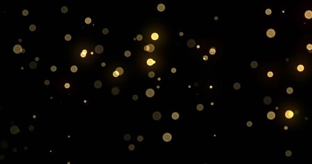 Light bokeh gold shine glitter background, abstract blur. Golden yellow glitter particle flares effect. Bright glowing shiny light bokeh sparkles on black backgroundの写真素材