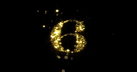 Number six glitter gold. Golden glittering number 6 with glister light and shiny sparks on black backgroundの写真素材