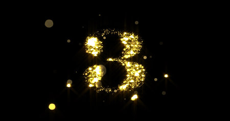Number three glitter gold. Golden glittering number 3 with glister light and shiny sparks on black backgroundの写真素材