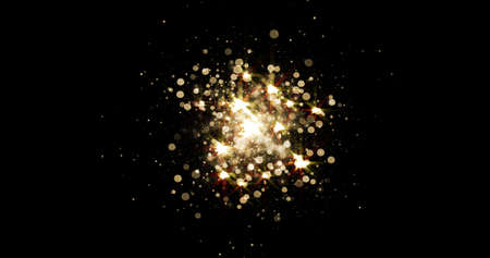 Gold light glitter background with sparkle glow and golden magic explosion. Star dust shine effect on black with golden particles bokeh in shiny glowing shimmerの写真素材