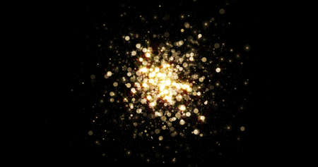 Explosion of gold particles lights, background with golden magic bokeh glitter. Sparkling dust with glow shine effect, shine, shimmer of glitter sparks on blackの写真素材