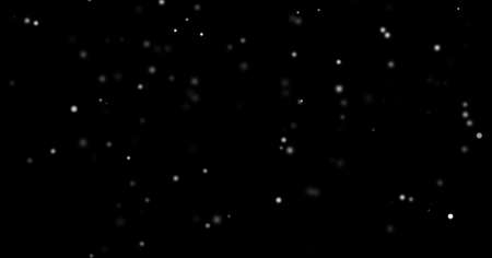 Snow fall and snowflakes background with bokeh light effect. Christmas snowfall or snow flakes falling with light shine of particles in winter night skyの写真素材
