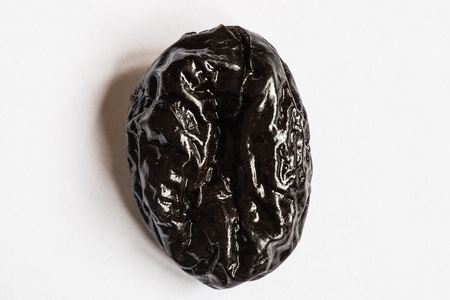 prunes on a white background. Dried plumの写真素材
