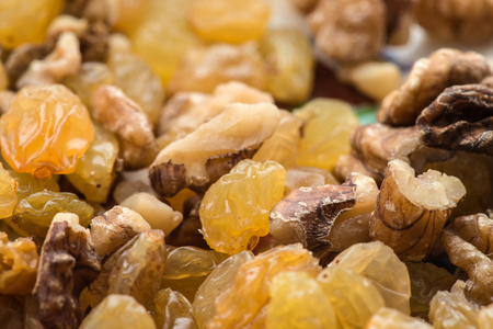 raisins and walnuts closeup background. macro photographyの写真素材