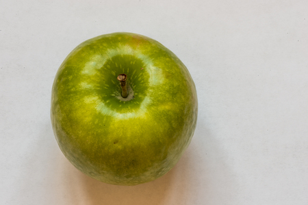 Green apple isolated on a white background.の写真素材
