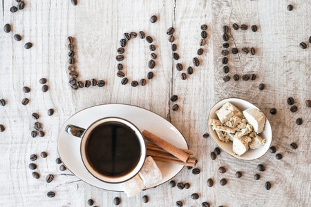 title love from coffee grains with coffee cup and sweetsの写真素材