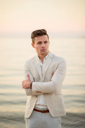 young handsome man at the beachの写真素材