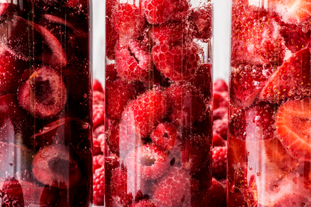 Macro shoot detox water in three bottles with berries. close-upの写真素材
