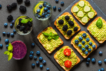 Set of vegetarian toast sandwiches with avocado and drinks. Variety of healthy food and drinks.の写真素材