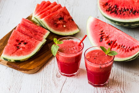 healthy drinks. watermelon smoothie on white wooden backgroundの写真素材