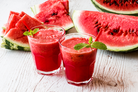 healthy drinks. watermelon smoothie on white wooden backgroundの写真素材