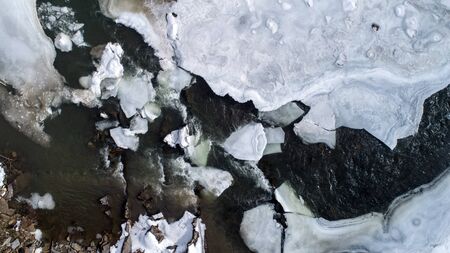 View of a mountain river in the Carpathians in winterの写真素材