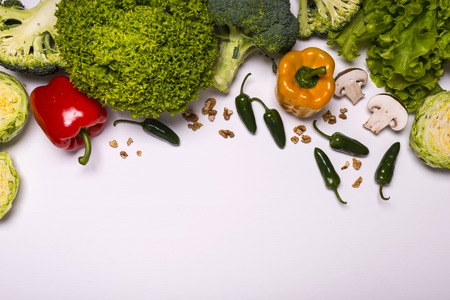 Fresh vegetables and fruits on white background. Detox diet. Different colorful fresh vegan food. Flat lay. Space for textの写真素材