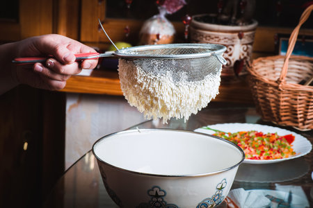 The process of making traditional Easter molded cottage cheese dessert paska.