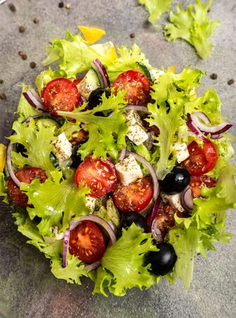 Classic greek salad in a glass deep plate. Top view. Close-upの写真素材