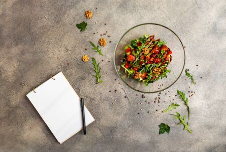 Vegetable salad with arugula, tomatoes, avocado, splashed with balsamic sauce.の写真素材