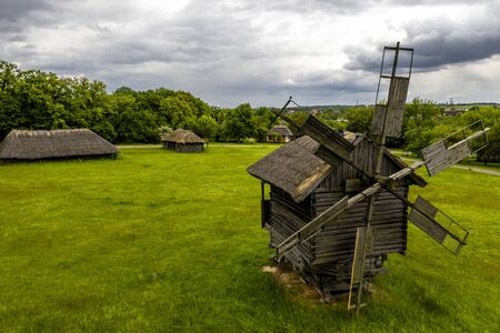 Traditional ukrainian wooden windmill in the museum of national architecture in Pirogovo.の写真素材