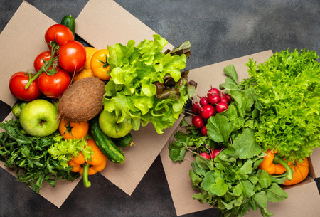 Order and delivery food. organic vegetables in boxes top view.