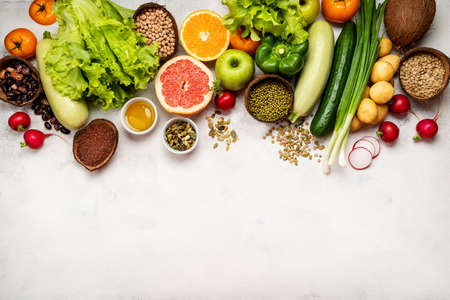 Vegan healthy food border on white background. Top view with place for textの写真素材