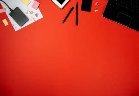 Border of business workplace supplies and gadgets. Copy space top view.の写真素材