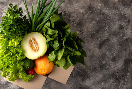 Different organic fresh vegetables in box. Order and delivery food concept top view