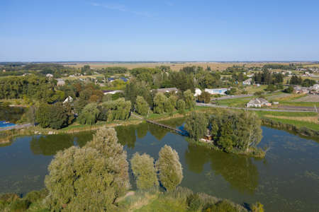 Wooden fishermans and hunters house on the island. Old Solotvyn Village, Ukraine aerial viewの写真素材