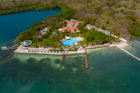 Tropical paradise white sand beach and relaxation zone on the island aerial viewの写真素材
