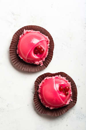 Pink mousse cakes on white background top viewの写真素材