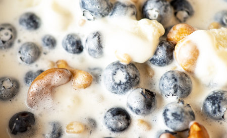 Beautiful breakfast - ice cream, berries cashew, cedar, blueberry and honey in the plate. Good...