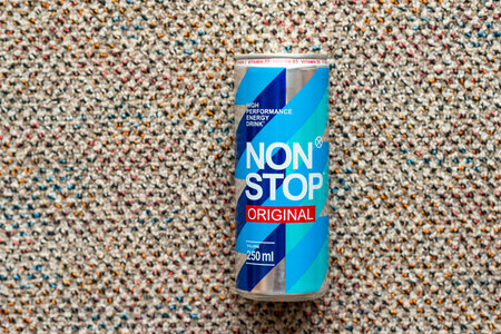 KYIV, UKRAINE - JULY 26, 2023: Can Non Stop energy drink on wool background