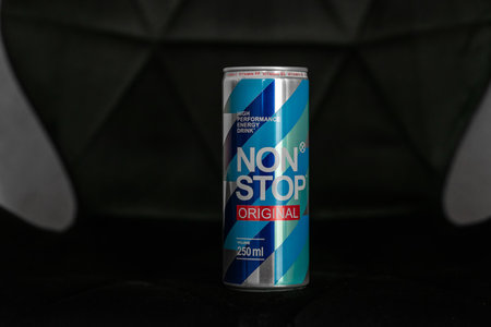 KYIV, UKRAINE - JULY 26, 2023: Can Non Stop energy drink on a black background close-upのeditorial素材