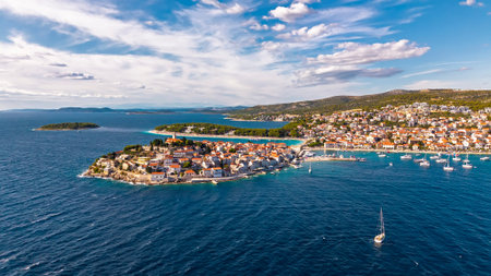 Drone panorama of Primosten Croatia showing historic peninsula marina yachts and turquoise Adriatic...