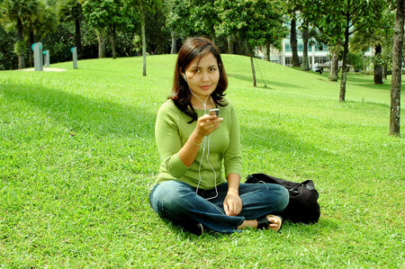 Listening to the music at garden の写真素材