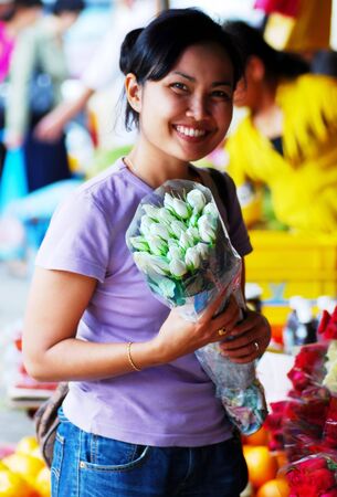 Women with smiling face at flower shopの写真素材