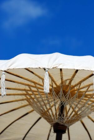 Closeup of umbrella againt the blue skyの写真素材