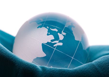 Blue globe on blue satinの写真素材