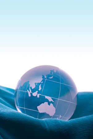 Globe on blue satin の写真素材