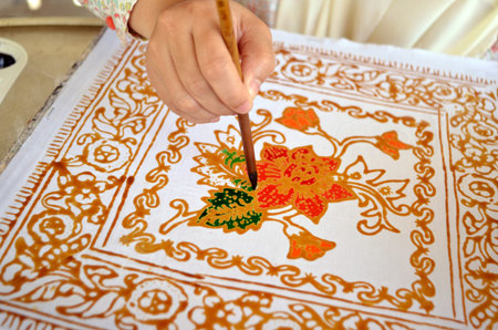 Terengganu, Malaysia - March, 9 2012: Coloring batik taken at batik factory in Terengganuのeditorial素材